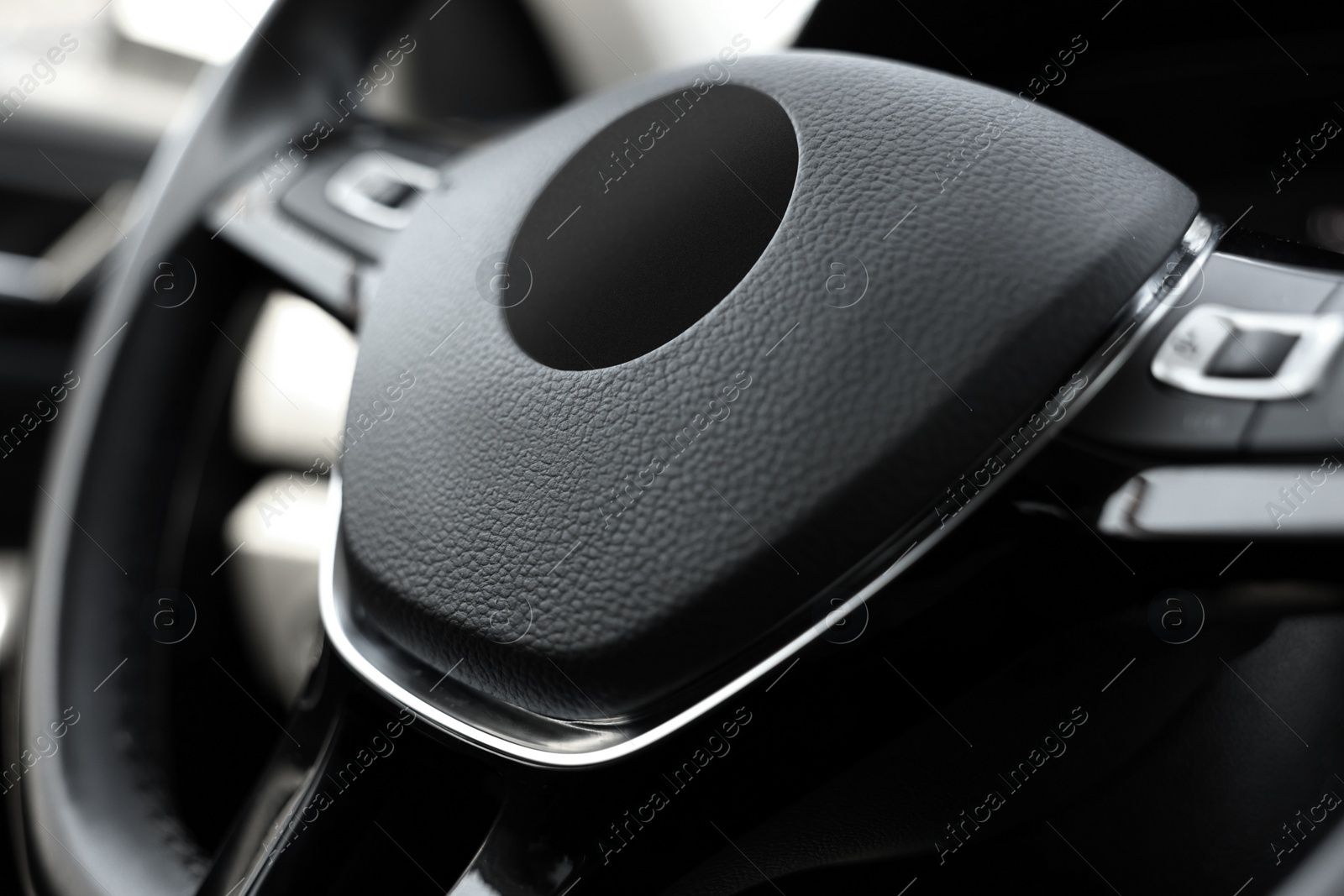 Photo of Safety airbag sign on steering wheel inside car