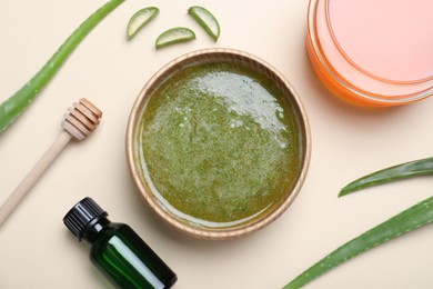 Homemade hair mask and ingredients on beige background, flat lay