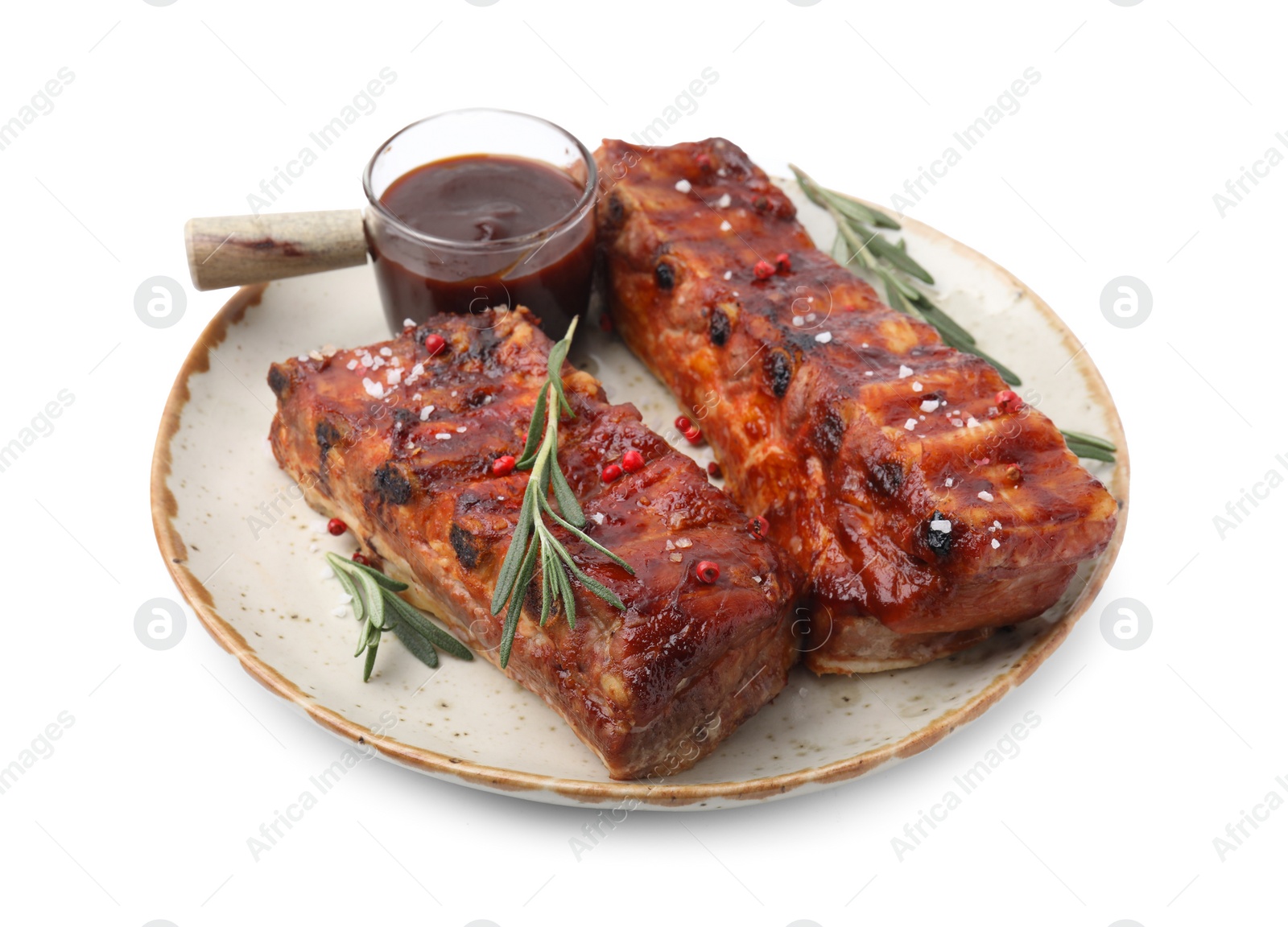 Photo of Tasty roasted pork ribs, sauce and rosemary isolated on white