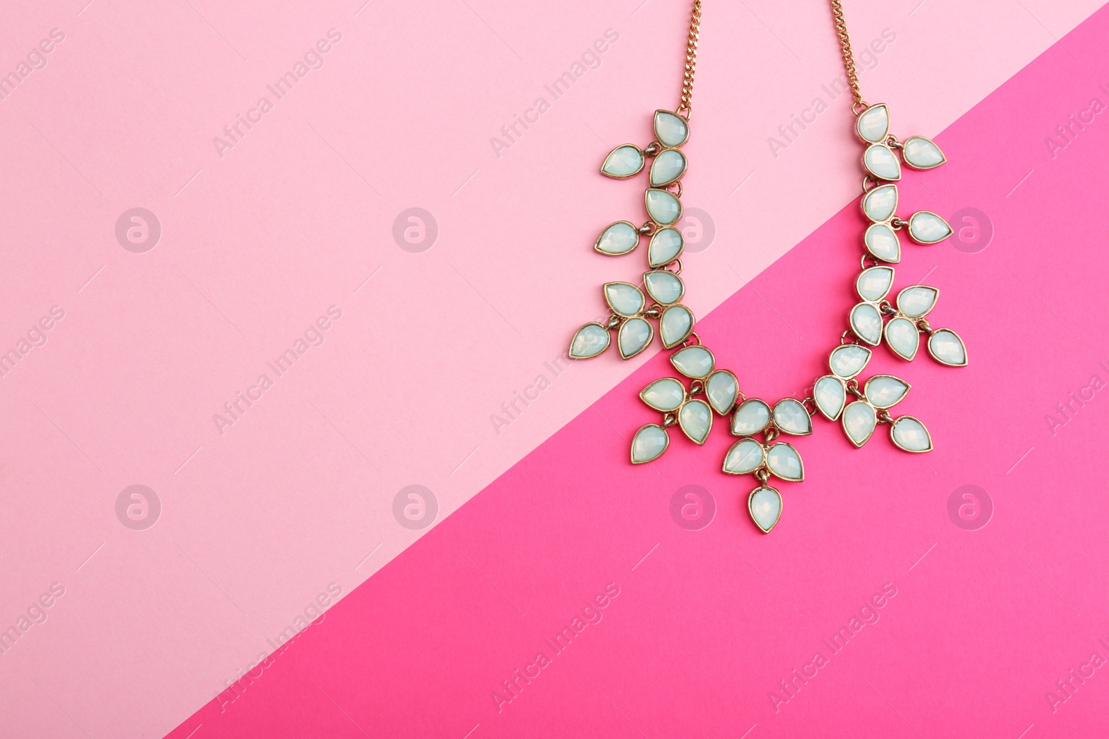 Photo of Beautiful necklace on color background, top view. Space for text