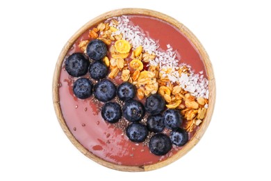 Bowl of delicious fruit smoothie with fresh blueberries, granola and coconut flakes isolated on white, top view