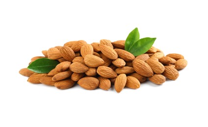 Photo of Pile of almond nuts and green leaves on white background. Healthy snack