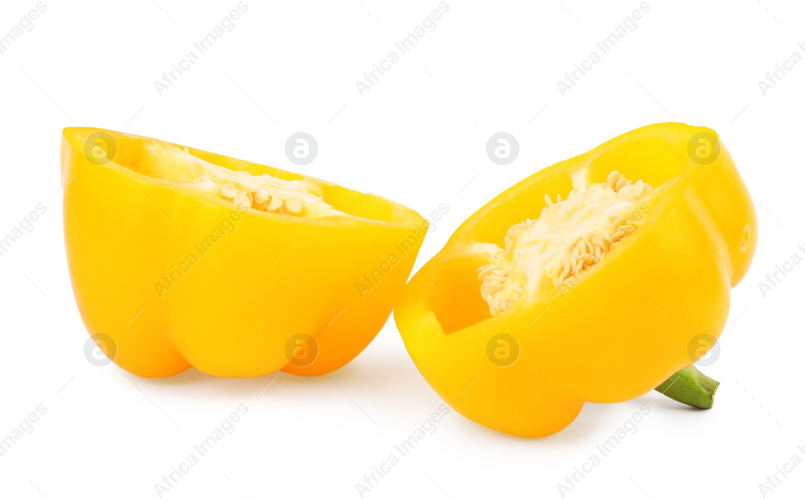 Photo of Halves of yellow bell pepper isolated on white