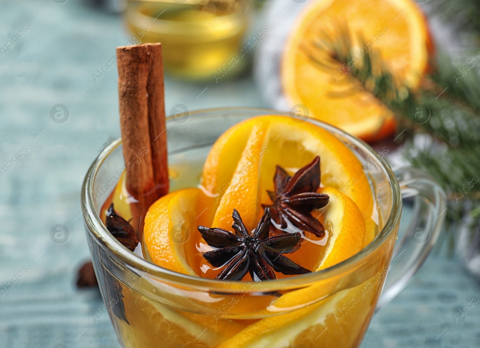 Photo of Delicious aromatic mulled wine on table, closeup