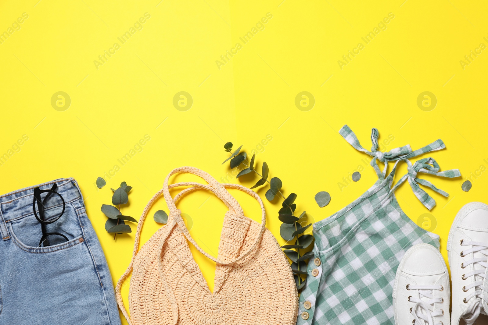 Photo of Set of stylish clothes on yellow background, flat lay. Space for text