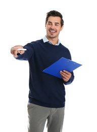 Young male teacher with clipboard on white background