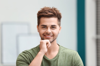 Photo of Portrait of handsome young man in room