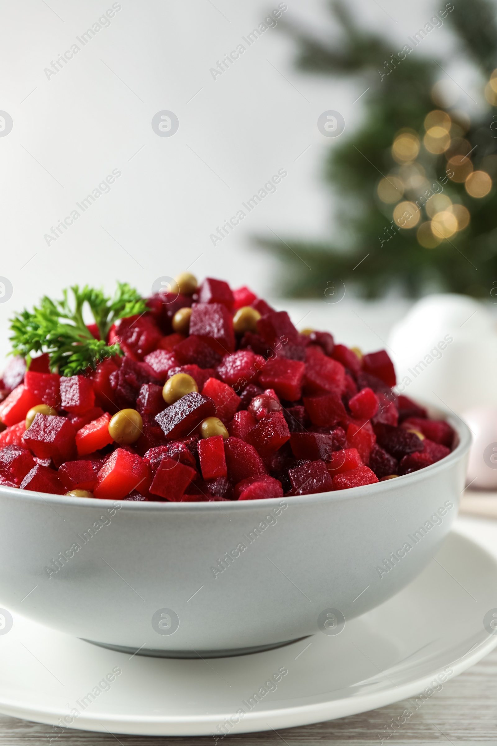 Photo of Traditional Russian salad vinaigrette in bowl, closeup