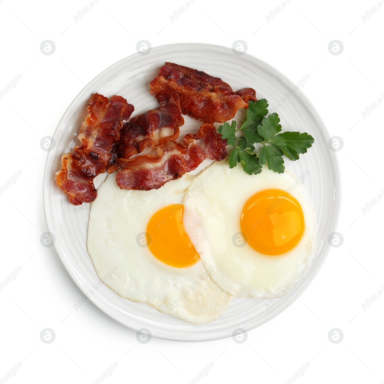 Photo of Delicious breakfast with sunny side up eggs isolated on white, top view