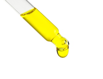 Pipette with essential oil on white background