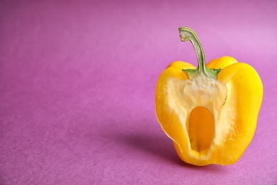 Photo of Cut ripe paprika pepper on color background