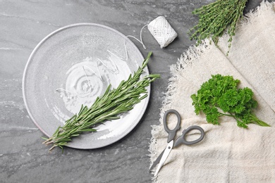 Flat lay composition with rosemary on table. Aromatic herbs