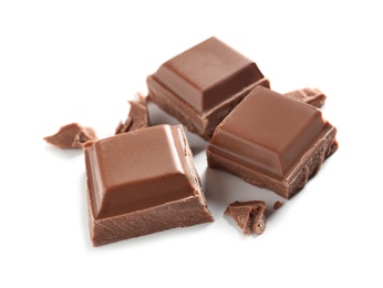 Photo of Pieces of tasty milk chocolate on white background