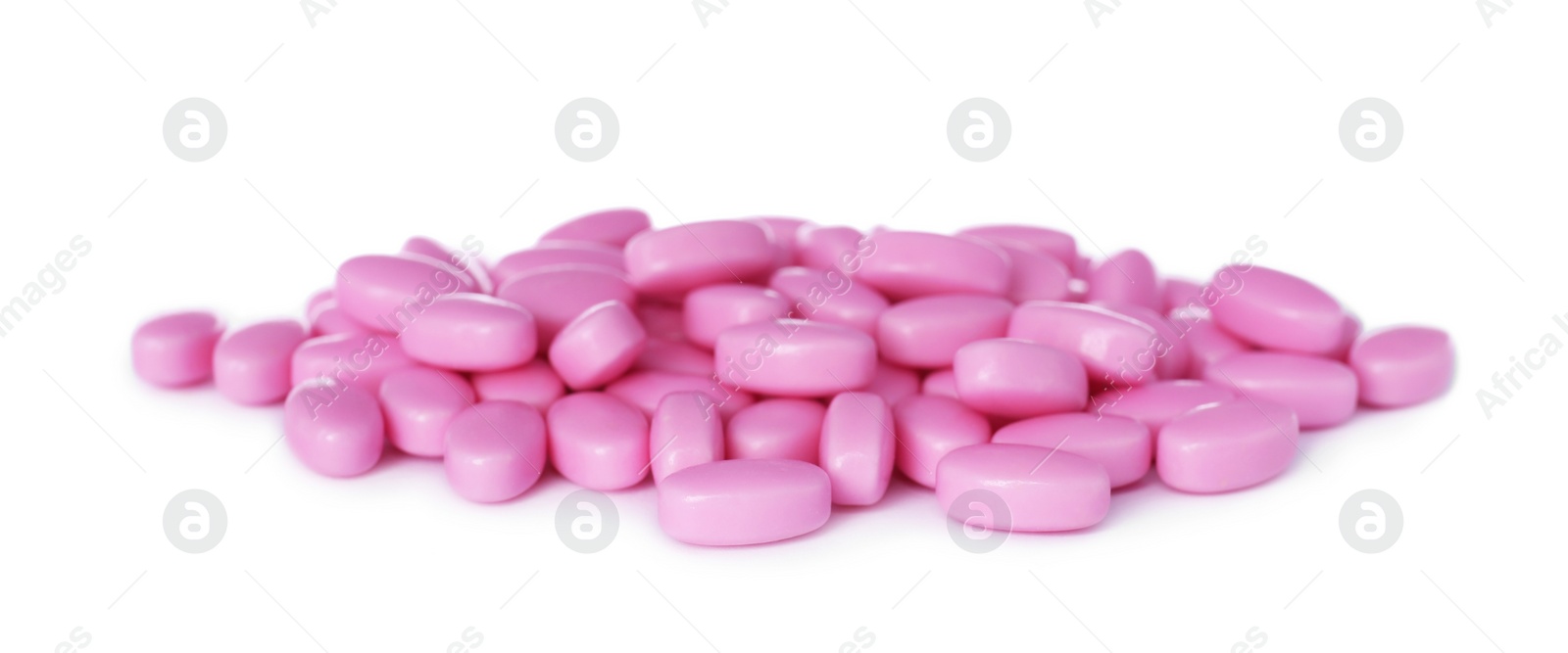 Photo of Tasty pink dragee candies on white background