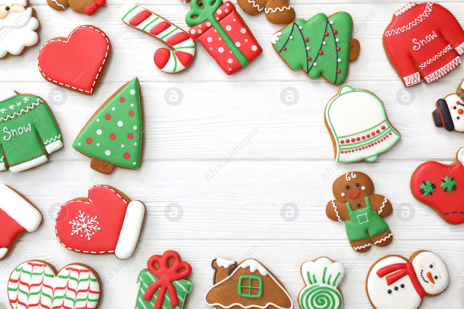 Photo of Frame of different delicious Christmas cookies on white wooden table, flat lay. Space for text