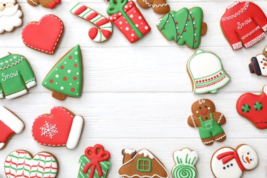 Photo of Frame of different delicious Christmas cookies on white wooden table, flat lay. Space for text