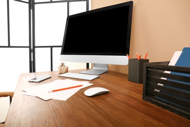 Photo of Comfortable workplace with modern computer on table. Space for design