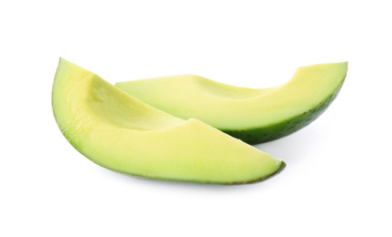 Slices of ripe avocado isolated on white