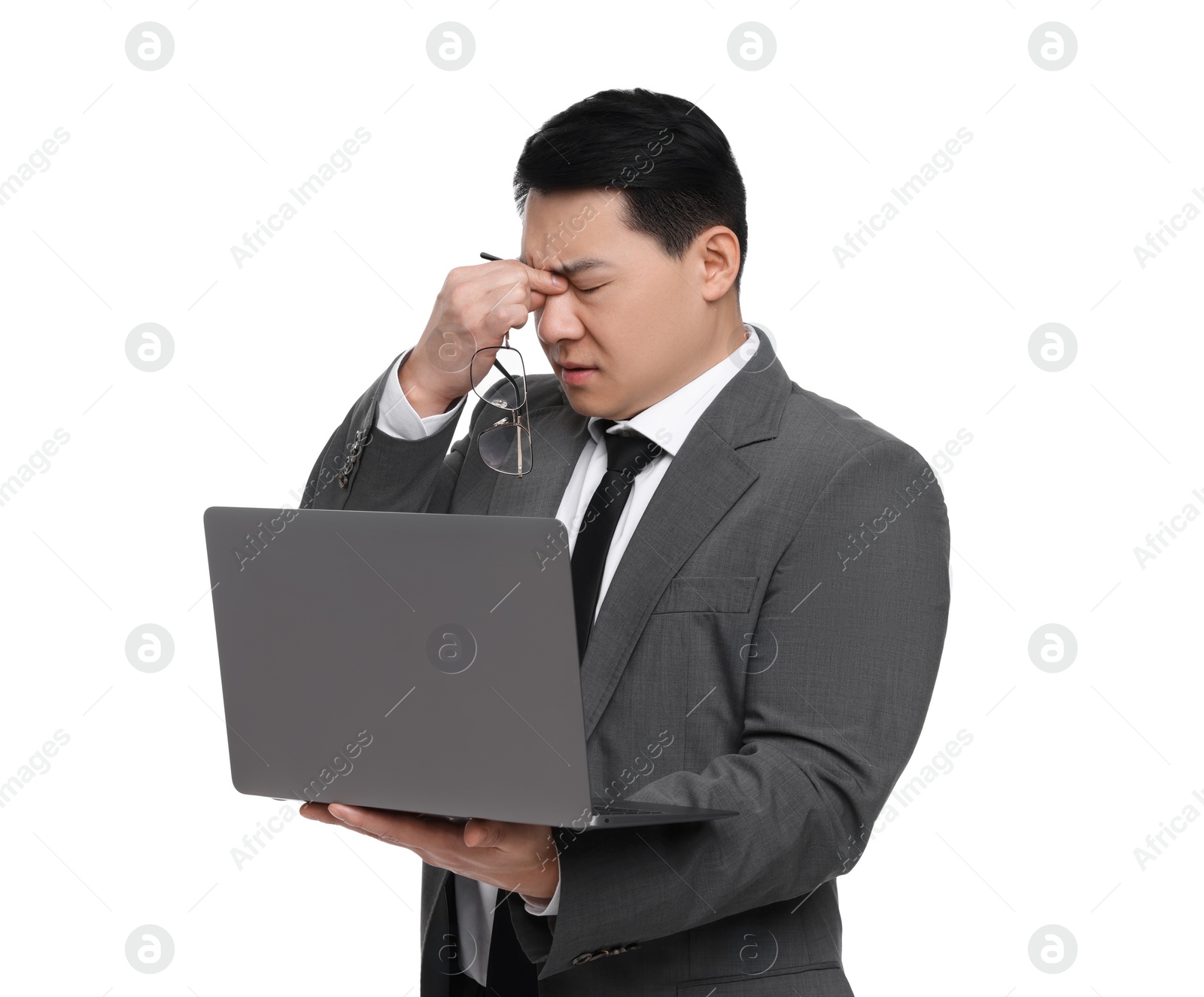 Photo of Tired businessman in suit with laptop on white background