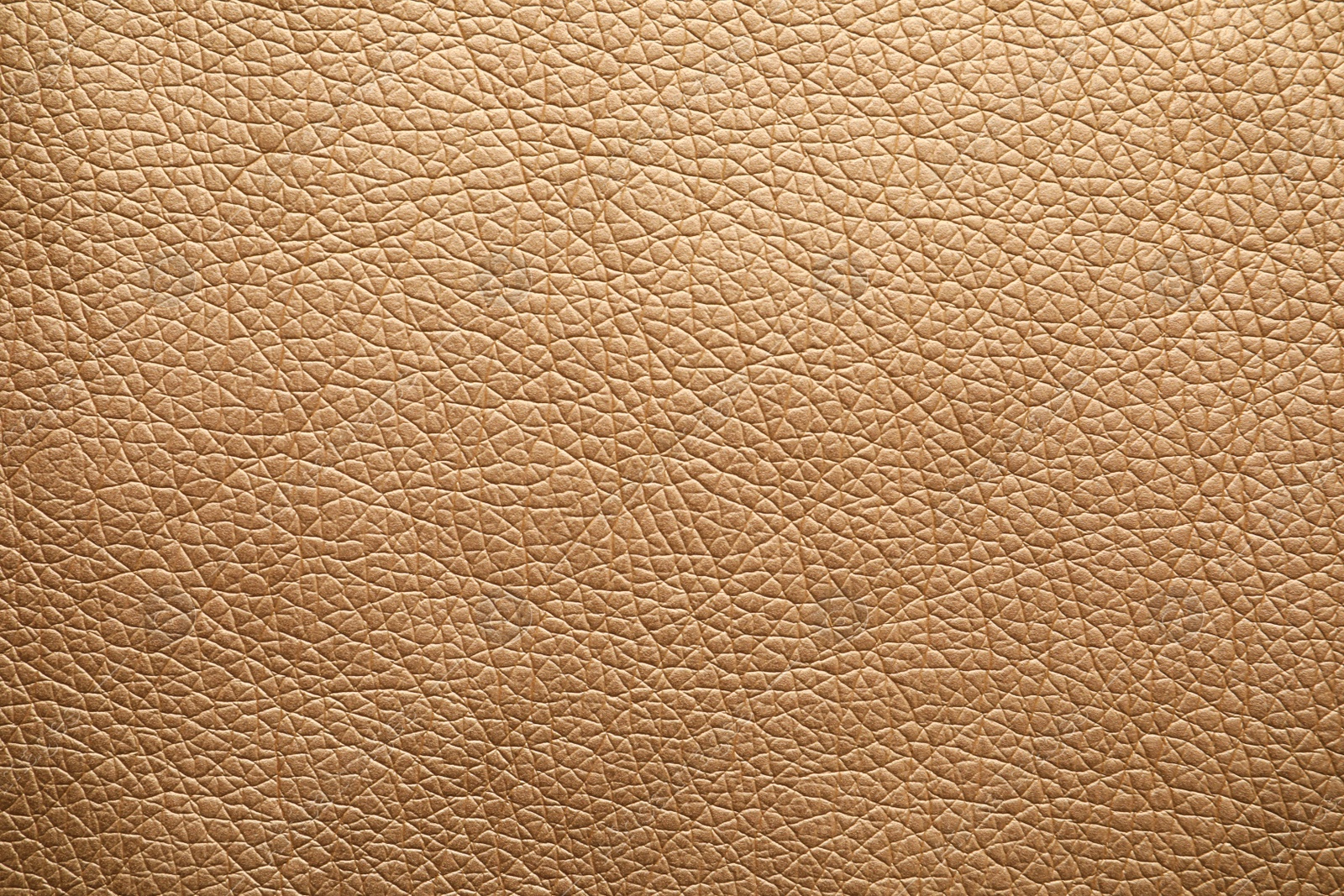 Photo of Texture of beige leather as background, closeup