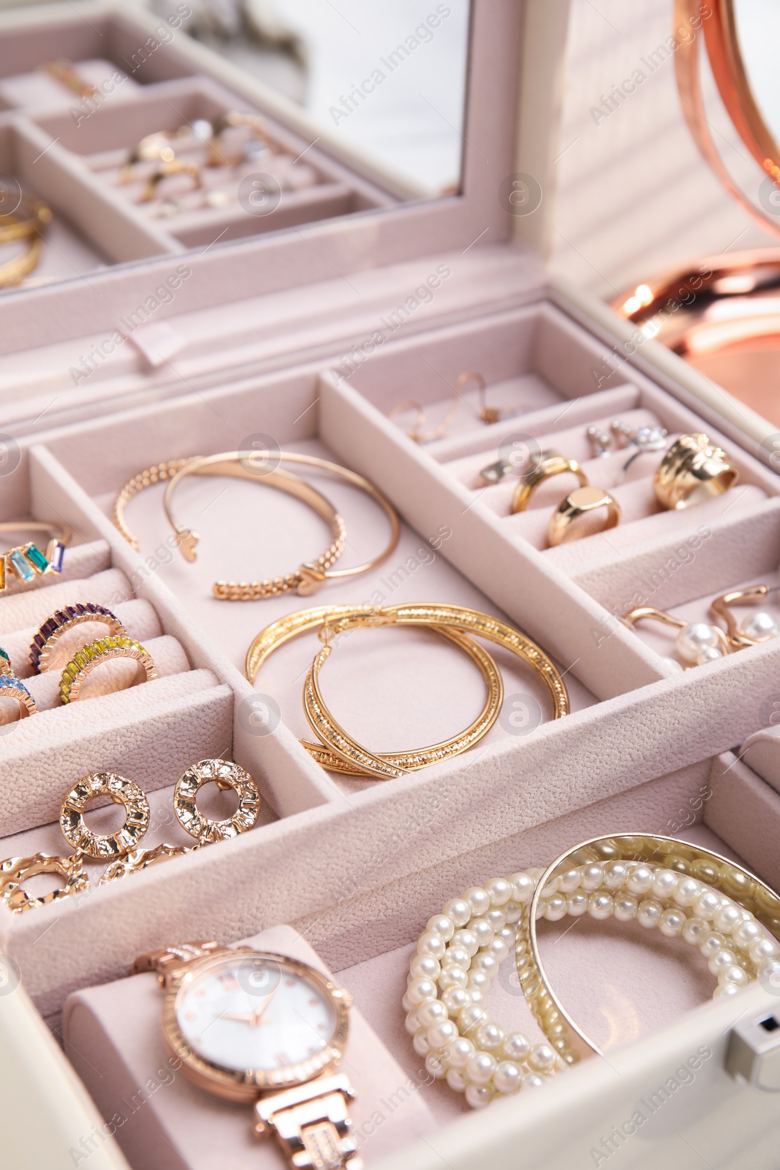 Photo of Jewelry box with stylish golden bijouterie, closeup view