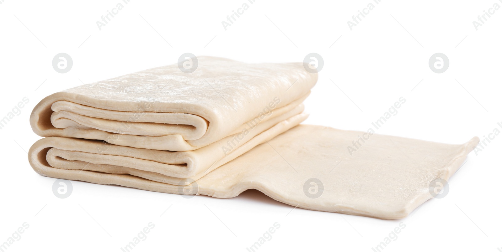 Photo of Fresh dough on white background. Puff pastry