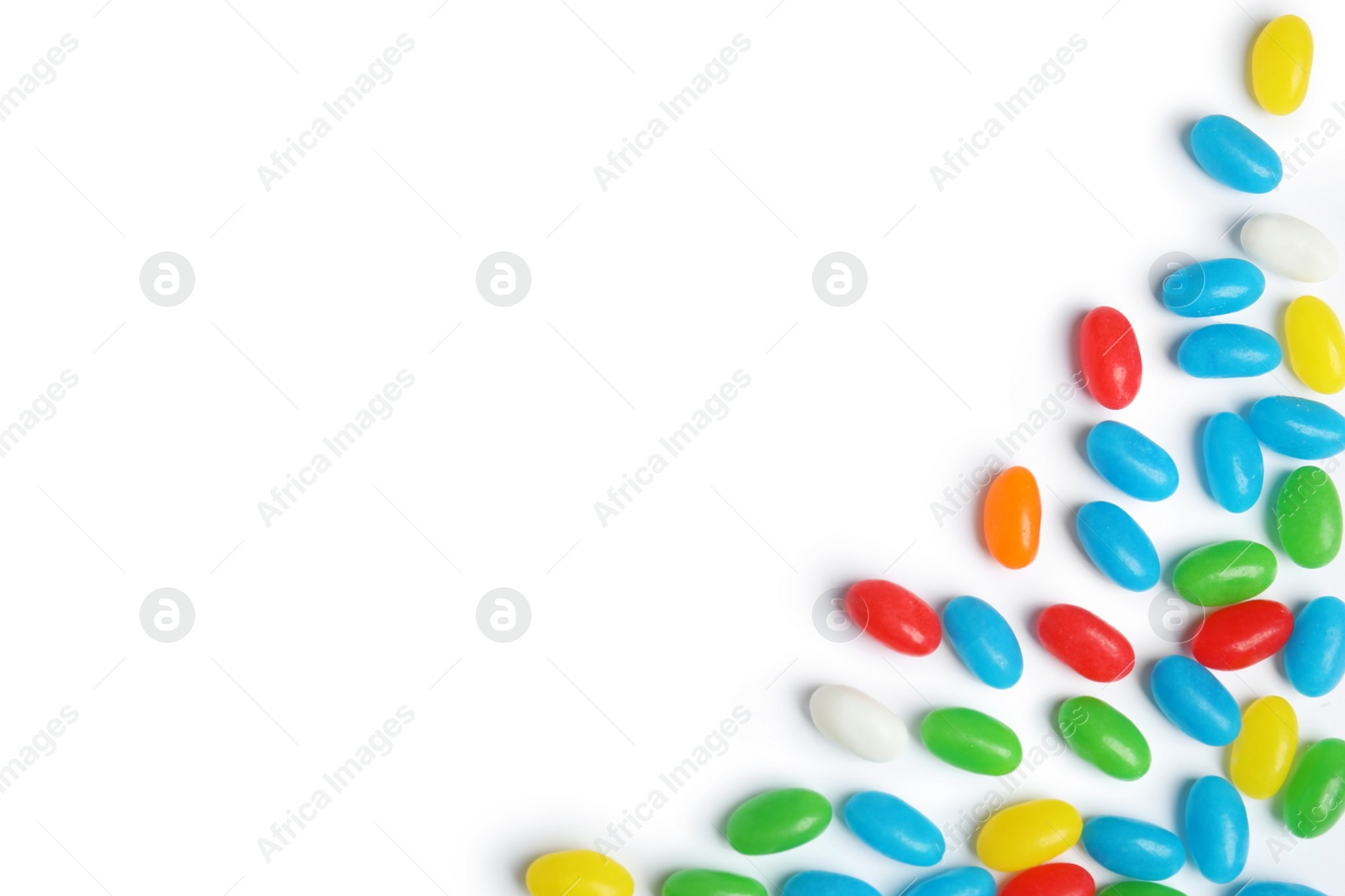 Photo of Colorful jelly beans on white background, top view