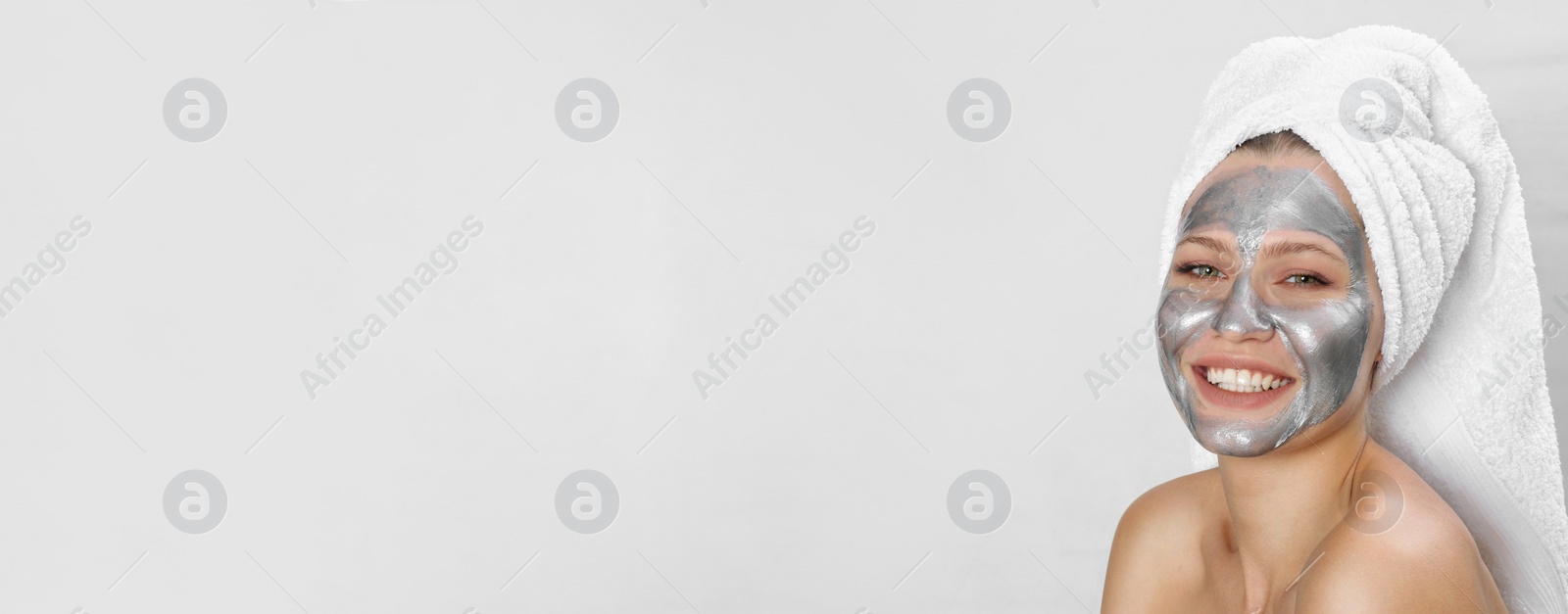 Image of Beautiful woman with silver mask on her face against light background, space for text. Banner design