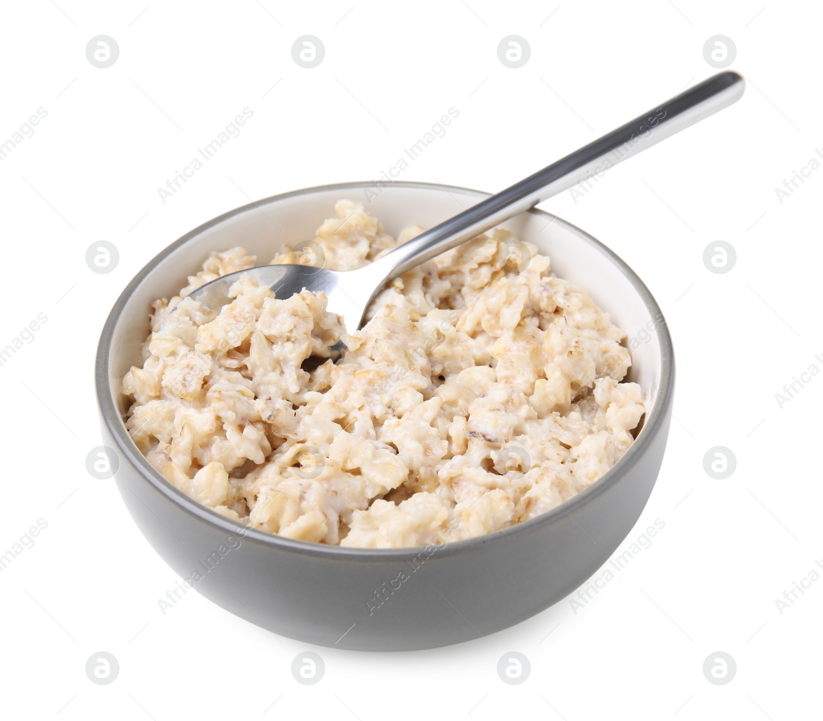 Photo of Ceramic bowl and spoon with oatmeal isolated on white