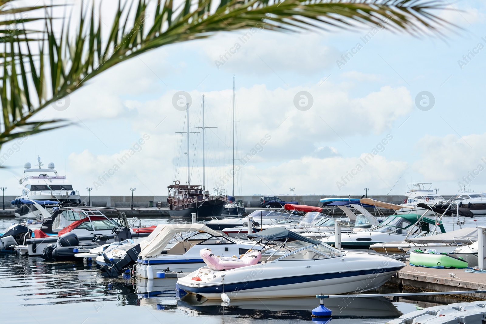 Photo of Beautiful view of city pier with moored boats on sunny day