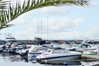 Photo of Beautiful view of city pier with moored boats on sunny day