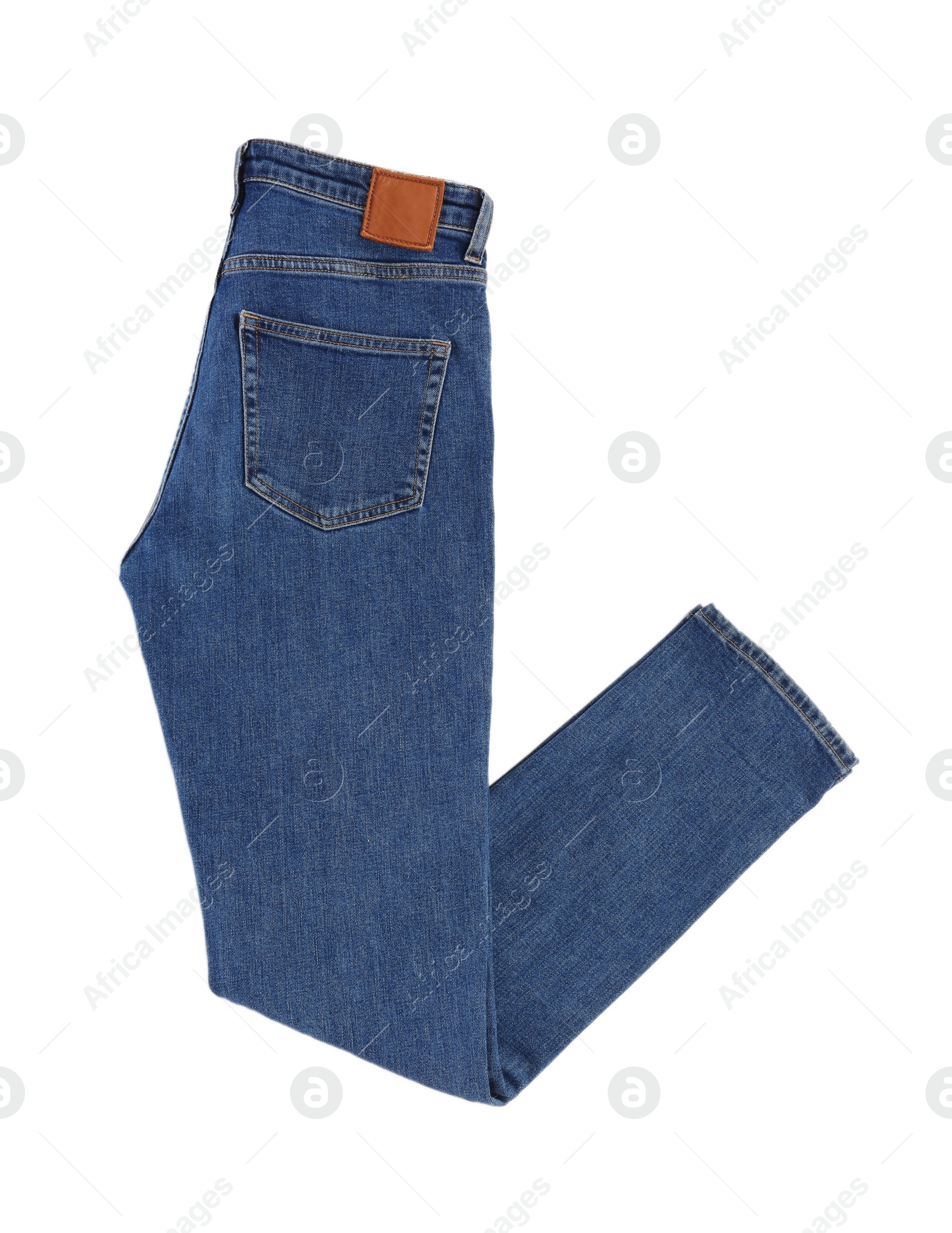 Photo of Dark blue jeans isolated on white, top view. Stylish clothes