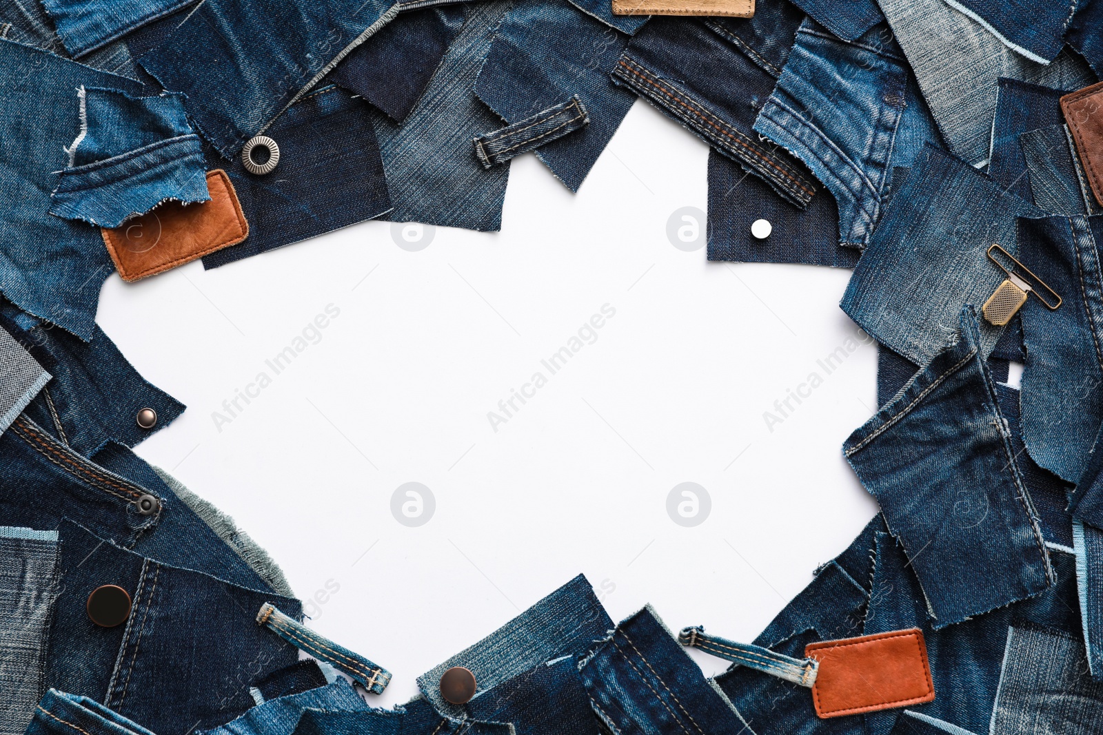 Photo of Frame made of cut jeans isolated on white. Space for text