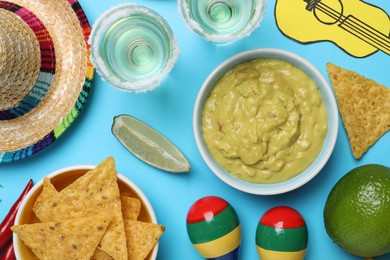 Flat lay composition with Mexican sombrero hat on light blue background