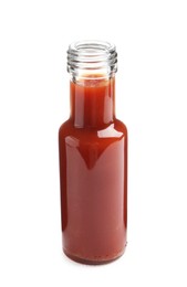 Photo of Tasty ketchup in glass bottle isolated on white. Tomato sauce