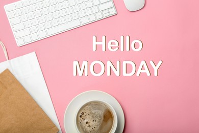 Image of Hello Monday, start your week with good mood. Cup of coffee, shopping bags and keyboard on pink background, flat lay