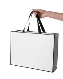 Woman holding paper bag on white background, closeup. Mockup for design