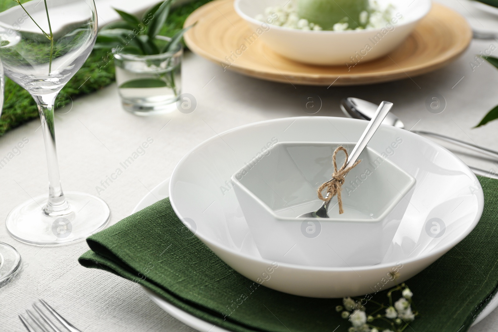 Photo of Stylish tableware and plants on table. Festive setting