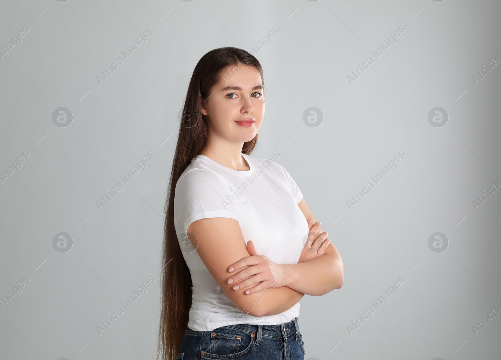 Photo of Portrait of young woman on light background