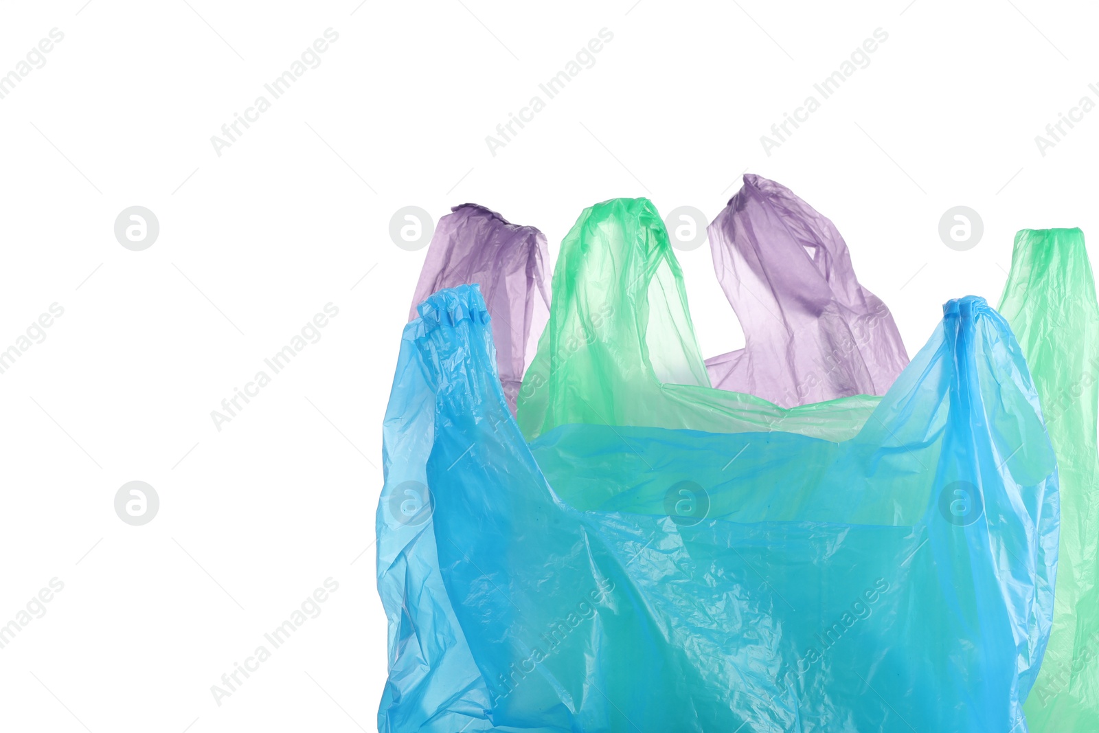 Photo of Many different plastic bags on white background