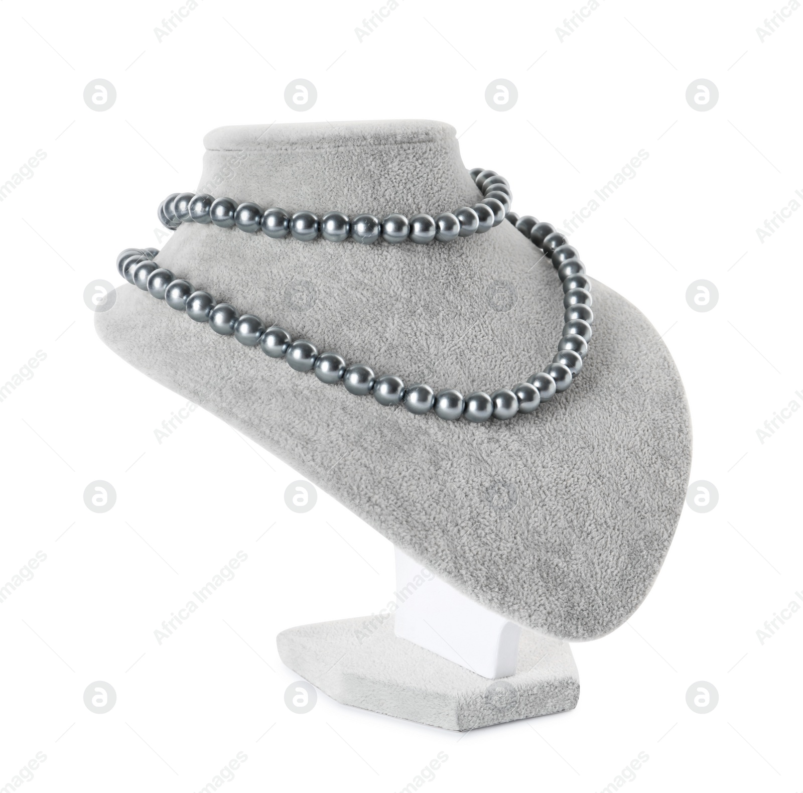 Photo of Stylish pearl necklace on jewelry bust against white background