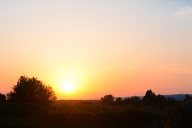 Photo of Picturesque view of countryside landscape at sunset
