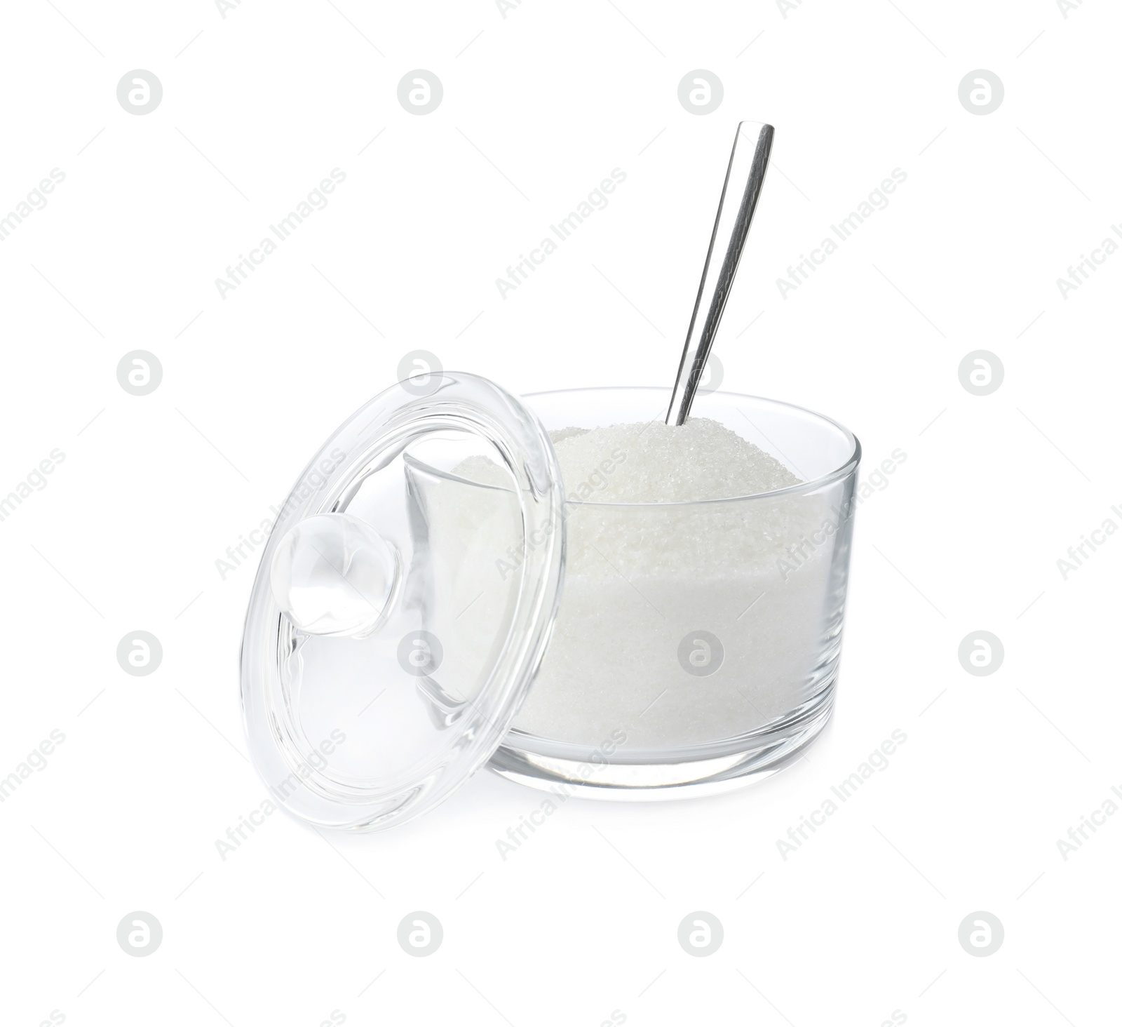 Photo of Glass bowl with sugar and spoon isolated on white