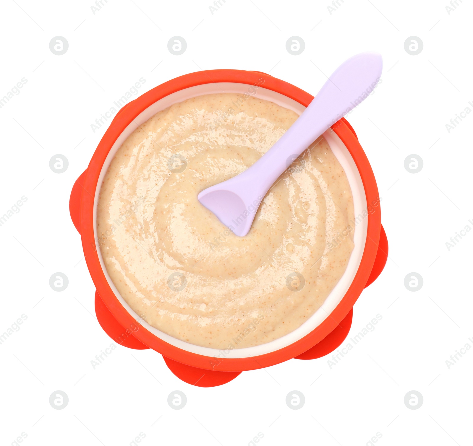 Photo of Tasty baby food and spoon in bowl isolated on white, top view