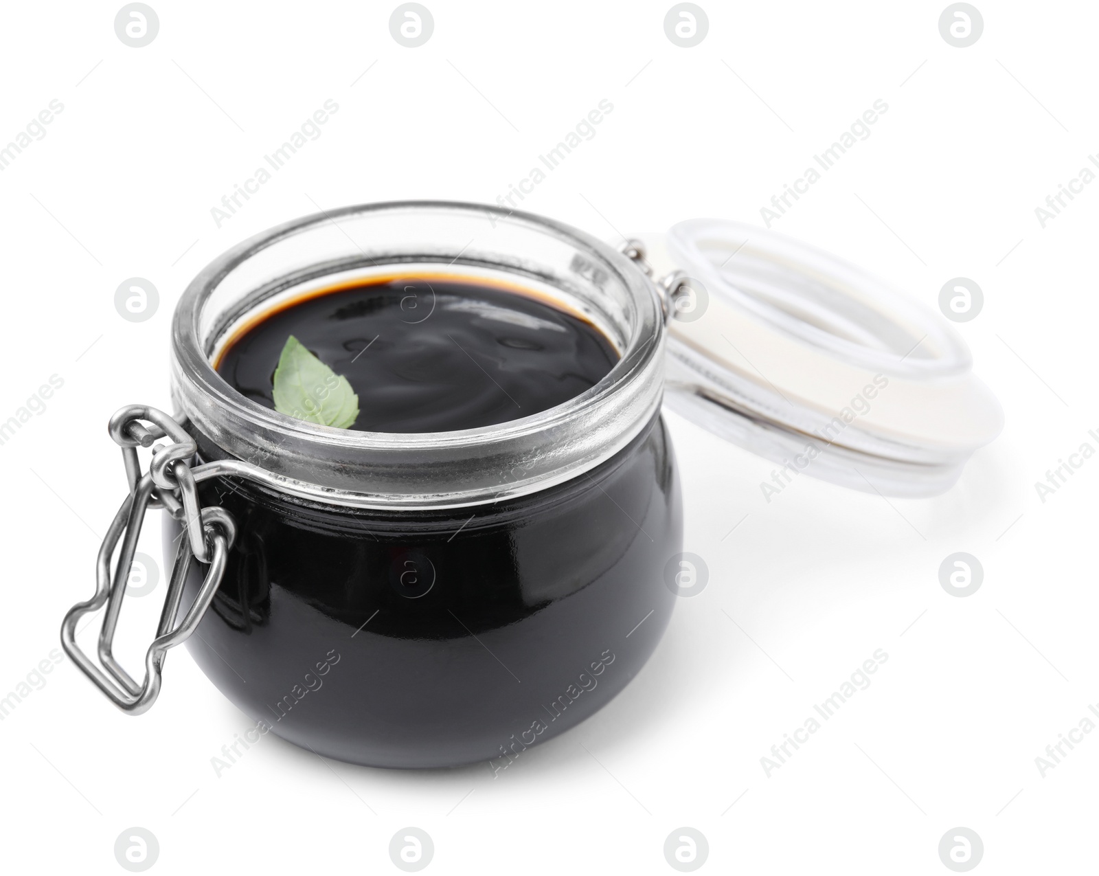 Photo of Glass jar with balsamic glaze isolated on white