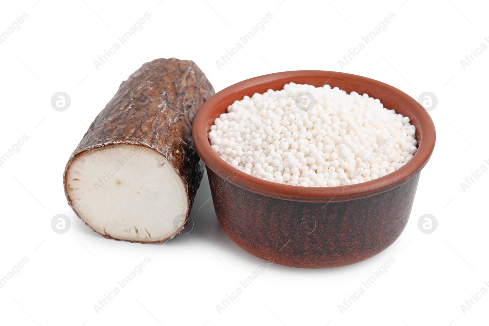 Photo of Tapioca pearls in bowl and cassava root isolated on white