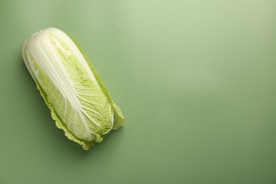 Photo of Fresh ripe Chinese cabbage on pale green background, top view. Space for text