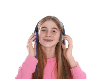 Teenage girl enjoying music in headphones on white background