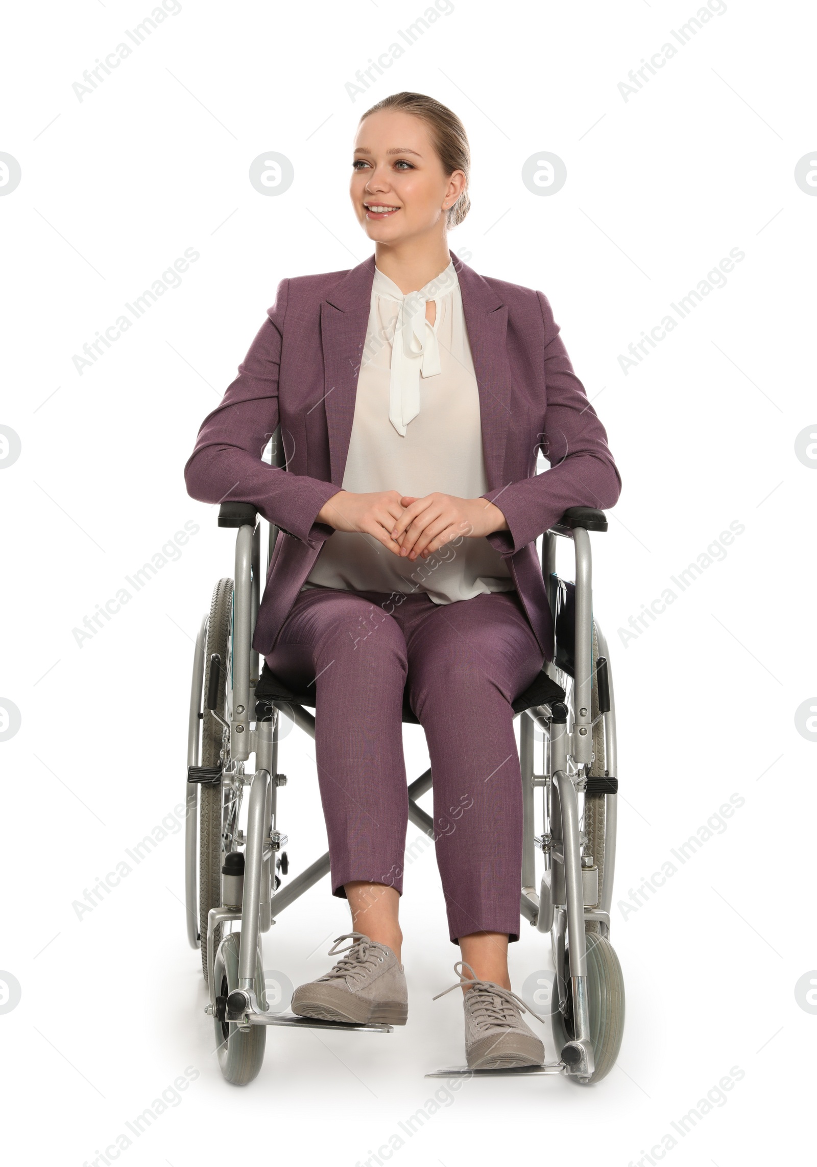 Photo of Beautiful young businesswoman in wheelchair isolated on white