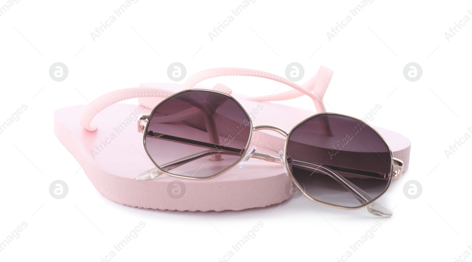 Photo of Flip flops and sunglasses on white background. Beach objects